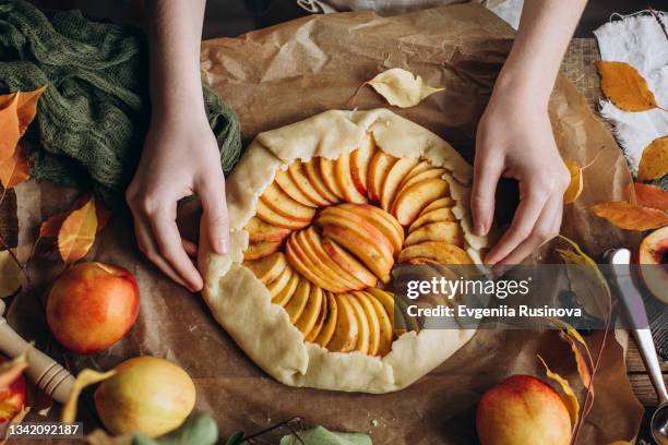 the process of making a pie with nectarines - sweet pie stock pictures, royalty-free photos & images