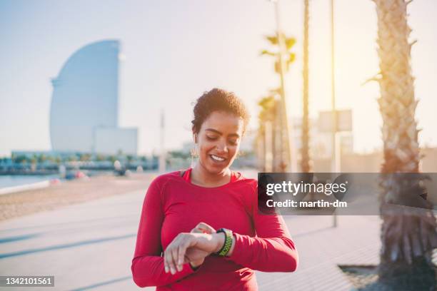 sportswoman jogging in barcelona - center athlete stock pictures, royalty-free photos & images