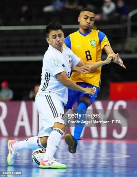 Katsutoshi Henmi of Japan battles for possession with Leonardo of Brazil during the FIFA Futsal World Cup 2021 Round of 16 match between Brazil and...