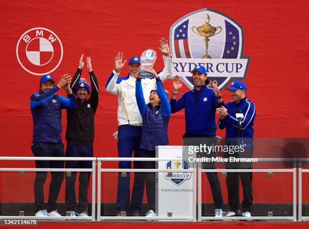 Teemu Selanne, Tom Felton, Toni Kukoc, Stephanie Szostak, Sasha Vujacic, and Alessandro Del Piero celebrate with the trophy after winning the...