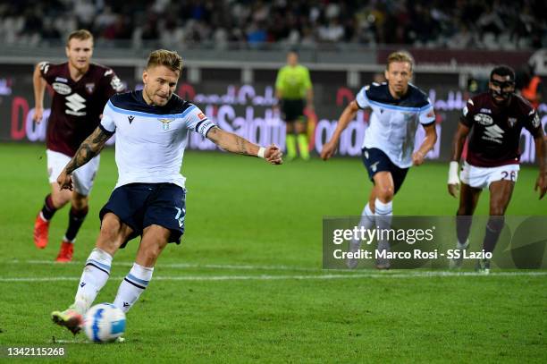 Ciro Immobile of SS Lazio scores a first goal a penalty during the Serie A match between Torino FC v SS Lazio at Stadio Olimpico di Torino on...