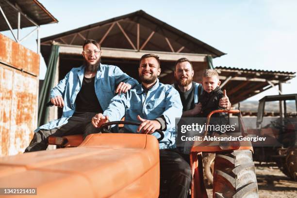 farming family riding on tractor together - macedonia country stock pictures, royalty-free photos & images