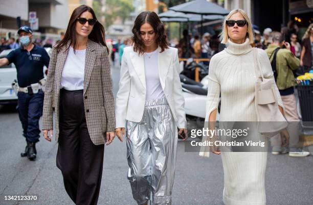 Deborah Reyner Sebag wearing checkered blazer, Erika Boldrin wearing silver pants, creme white blazer and Linda Tol wearing creme white dress,...