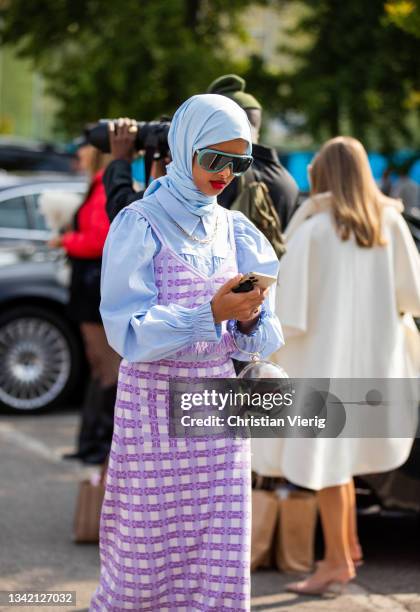 Guest is seen outside Boss during the Milan Fashion Week - Spring / Summer 2022 on September 23, 2021 in Milan, Italy.