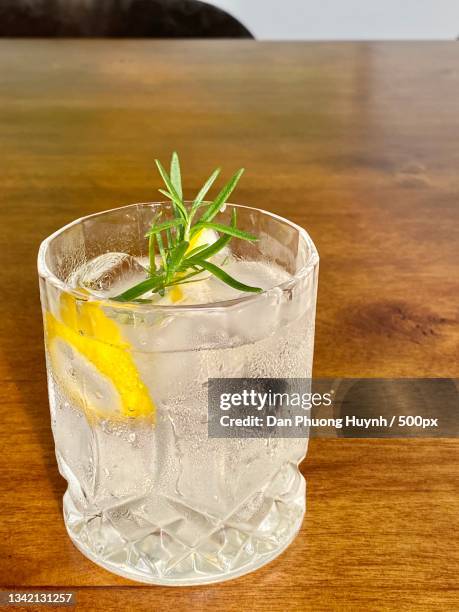 close-up of drink on table - a vodka soda with lime stock pictures, royalty-free photos & images