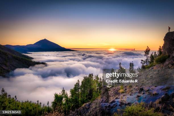 views of teide with clouds and the volcano of la palma in the background - la palma stock pictures, royalty-free photos & images