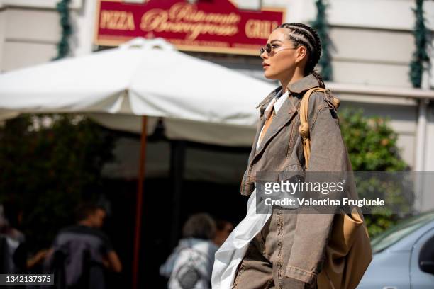 Karina Nigay outside Etro fashion show during the Milan Fashion Week wearing an Etro cropped denim jacket and pants - Spring / Summer 2022 on...