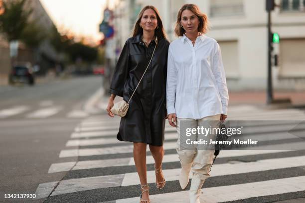 Michi Brandl wearing comma fashion look and beige Bottega Veneta leather bag, and Karin Teigl wearing full comma fashion look and black Chanel bag on...