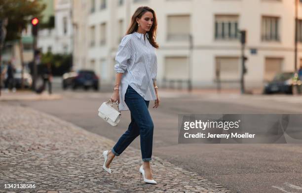 Alexandra Lapp wearing full comma fashion look and white Chanel leather bag on September 17, 2021 in Dusseldorf, Germany.