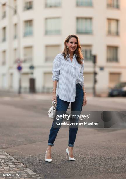 Alexandra Lapp wearing full comma fashion look and white Chanel leather bag on September 17, 2021 in Dusseldorf, Germany.