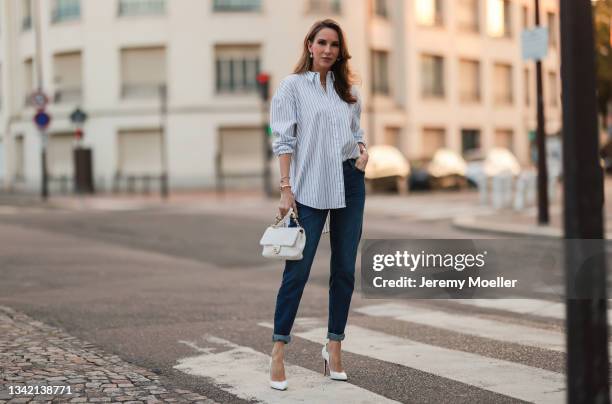 Alexandra Lapp wearing full comma fashion look and white Chanel leather bag on September 17, 2021 in Dusseldorf, Germany.