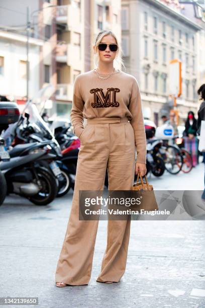 Valentina Ferragni outside Max Mara fashion show wearing a beige swater and beige pants during the Milan Fashion Week - Spring / Summer 2022 on...