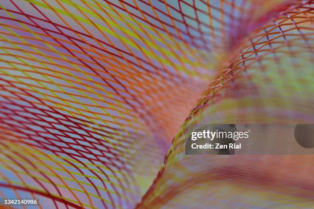 abstract image of a multi colored mesh ribbon in autumn colors - fibra fotografías e imágenes de stock