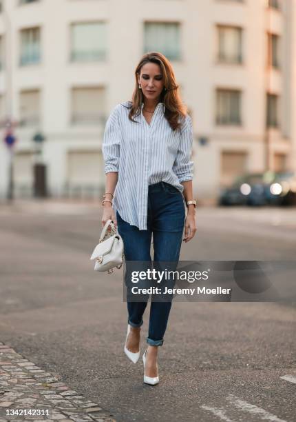 Alexandra Lapp wearing full comma fashion look and white Chanel leather bag on September 17, 2021 in Dusseldorf, Germany.