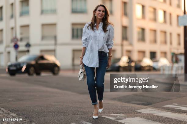 Alexandra Lapp wearing full comma fashion look and white Chanel leather bag on September 17, 2021 in Dusseldorf, Germany.