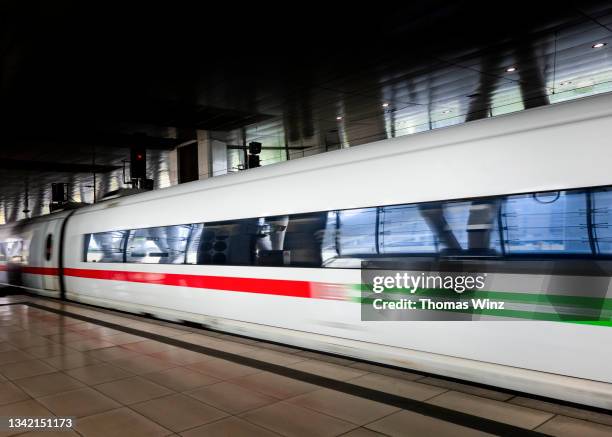 moving train at a train station - high speed train germany stock pictures, royalty-free photos & images