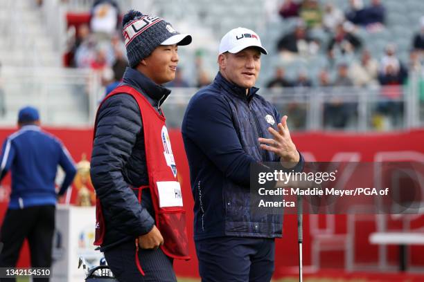 Hawk speaks with his caddie during the celebrity matches ahead of the 43rd Ryder Cup at Whistling Straits on September 23, 2021 in Kohler, Wisconsin.