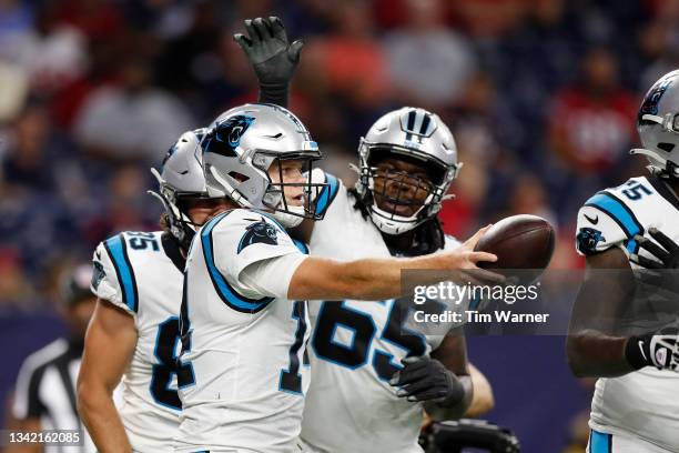Sam Darnold of the Carolina Panthers celebrates his first quarter touchdown with Dennis Daley while playing the Houston Texans at NRG Stadium on...