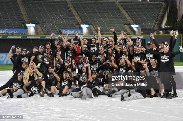 The Chicago White Sox celebrate on the field after clinging the American League Central title after game two of a double header against the Cleveland...