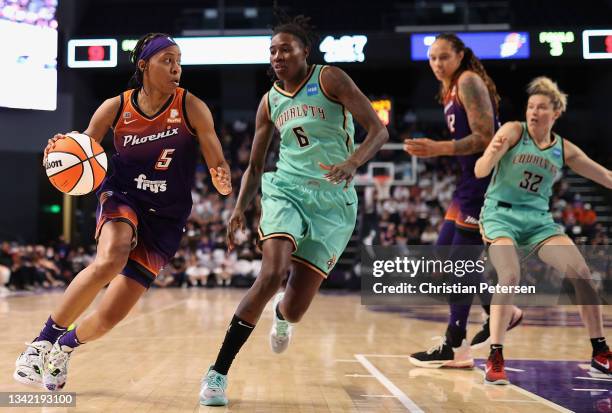 Shey Peddy of the Phoenix Mercury controls the ball past Natasha Howard of the New York Liberty during the second half of the first round WNBA...