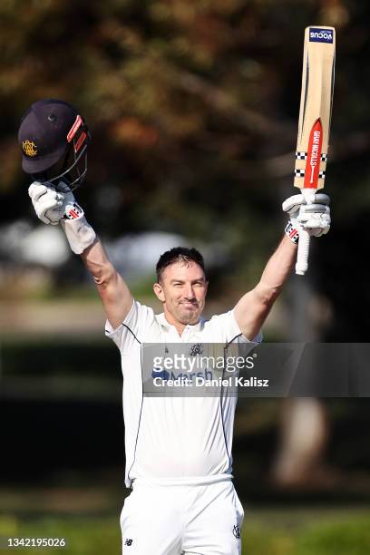 Shaun Marsh of Western Australia raises his bat after reaching his century during day one of the Sheffield Shield match between South Australia and...