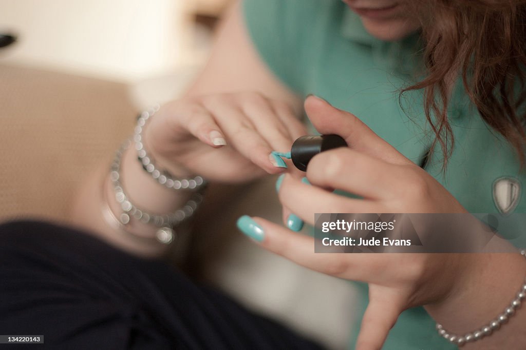 Girl painting nails