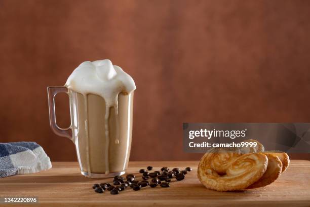 cappuccino cup with milk froth and palmier for breakfast - coffee foam imagens e fotografias de stock