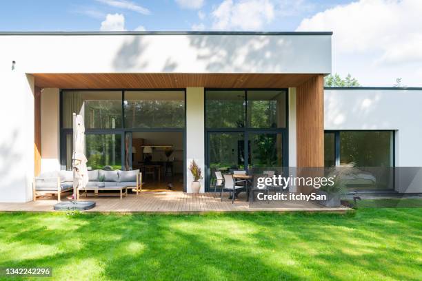 backyard of a modern private house - garden terrace stock pictures, royalty-free photos & images