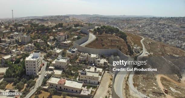 aerial view-israel defence barrier wall , jerusalem - israeli west bank barrier stock pictures, royalty-free photos & images