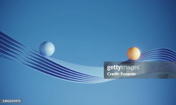 two balls moving on the ribbons - abstract movement stockfoto's en -beelden