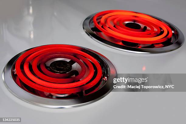 two hot electric burners in kitchen stove - electric stove burner stock pictures, royalty-free photos & images