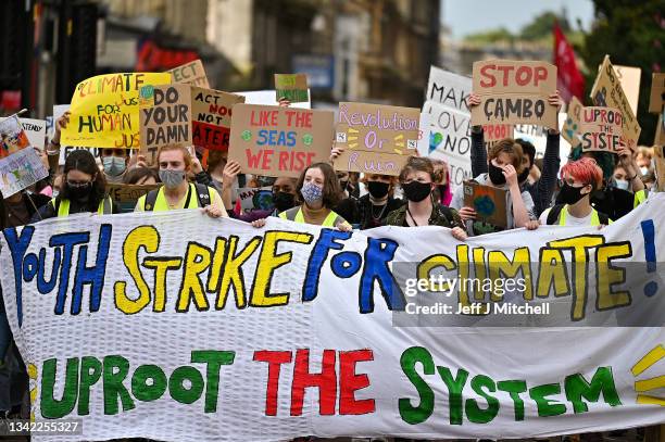 School children take part in a climate strike popularised by Swedish activist Greta Thunberg on September 24, 2021 in Glasgow, Scotland. The...