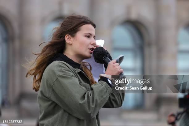 Climate activist Luisa Neubauer speaks at a large-scale climate strike march by Fridays for Future in front of the Reichstag on September 24, 2021 in...