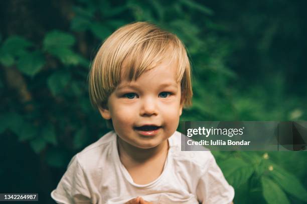 cute boy with blond hair and blue eyes - boy happy blonde stock pictures, royalty-free photos & images