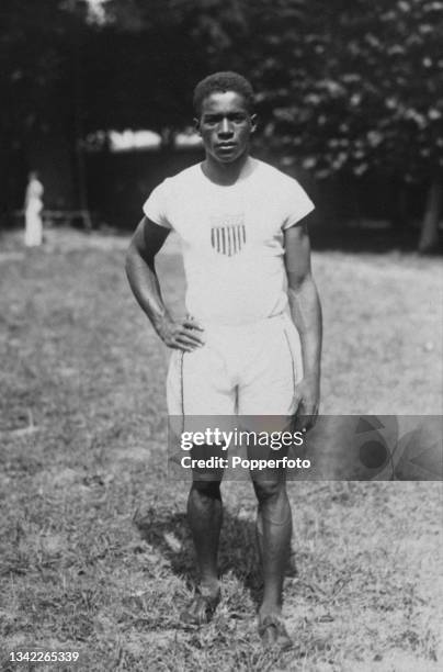 American athlete DeHart Hubbard wearing his United States kit during the men's long jump event at the 1924 Summer Olympics, at the Stade Olympique...