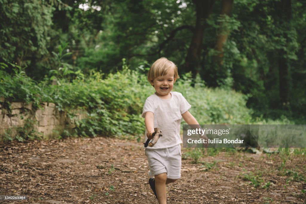 Three years small cute boy playing