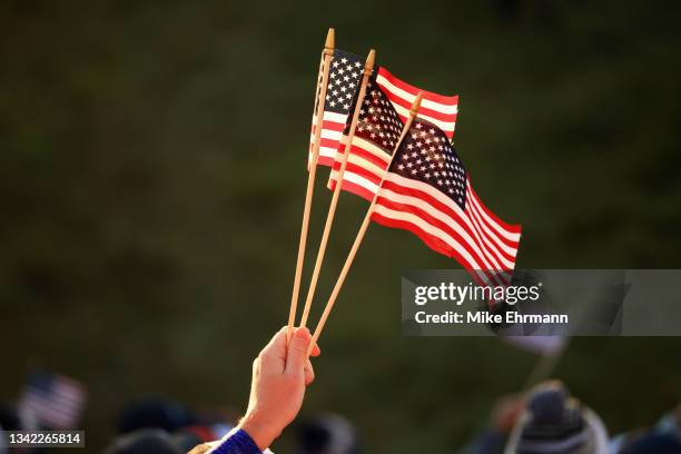 Fan holds American flags during Friday Morning Foursome Matches of the 43rd Ryder Cup at Whistling Straits on September 24, 2021 in Kohler, Wisconsin.