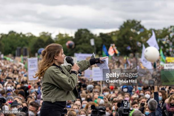 German Climate activist Luisa Neubauer speaks at a large-scale climate strike march by Fridays for Future in front of the Reichstag on September 24,...