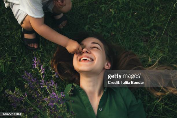 mother and her child enjoy the early spring - beauty face summer imagens e fotografias de stock