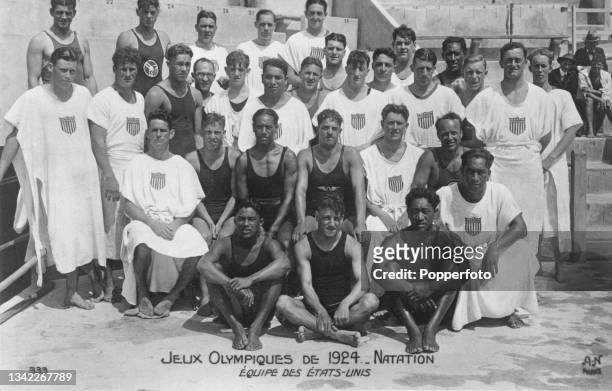 Male members of the United States swimming team pose together beside the Piscine ds Tourelles during the 1924 Summer Olympics in Paris, France in...