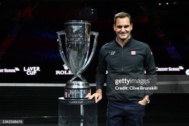 Roger Federer poses for a photograph with the Laver Cup Trophy after taking part in a live TV interview on CNBC at TD Garden on September 24, 2021 in...