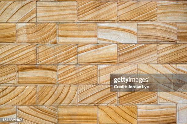 sand brick wall background - sandstone stock pictures, royalty-free photos & images