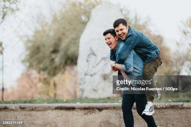 young gay couple enjoying each others company in the city,santiago de chile,chile - santiago stock pictures, royalty-free photos & images