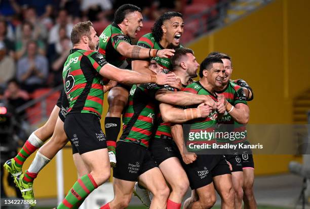 Cody Walker of the Rabbitohs is congratulated by team mates after scoring a try during the NRL Grand Final Qualifier match between the South Sydney...