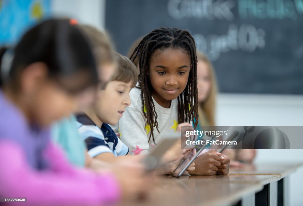 Students On Elearning Elementary Students Elearning High-Res Stock Photo - Getty Images