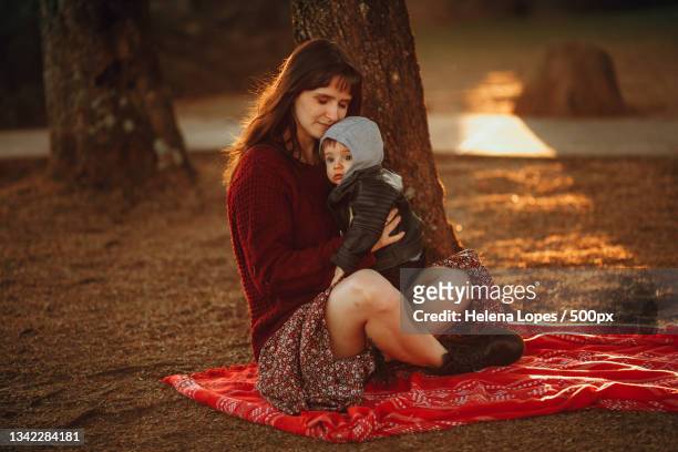mother and son having fun in park,belo horizonte,state of minas gerais,brazil - tough decisions stock pictures, royalty-free photos & images