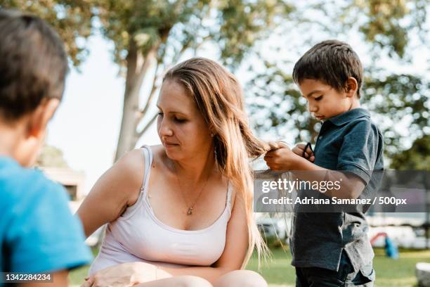 mother spending time with her son at the park,ica,peru - mental toughness stock pictures, royalty-free photos & images