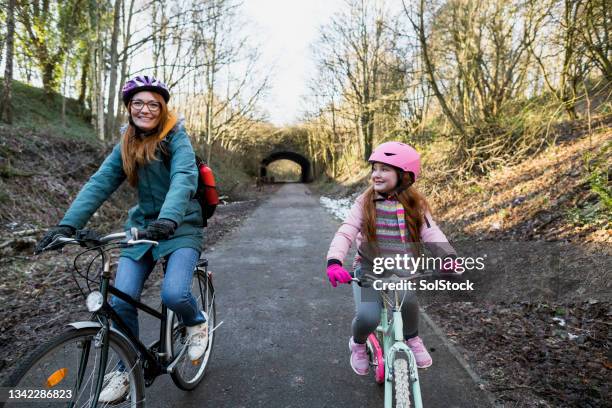 riding side by side! - winter cycling stock pictures, royalty-free photos & images