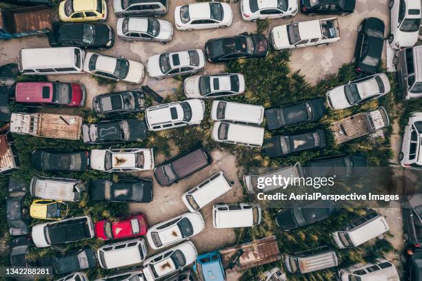 aerial view of wrecked and abandoned cars, vehicle junkyard - clutter stock pictures, royalty-free photos & images