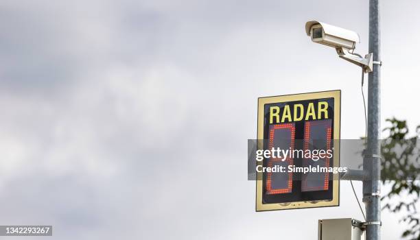 road radar with a camera measures and signals high speed when vehicles enter the city. - radar stock pictures, royalty-free photos & images